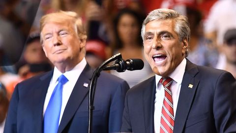 Rep. Lou Barletta stands beside President Donald Trump at a political rally in Pennsylania in August.