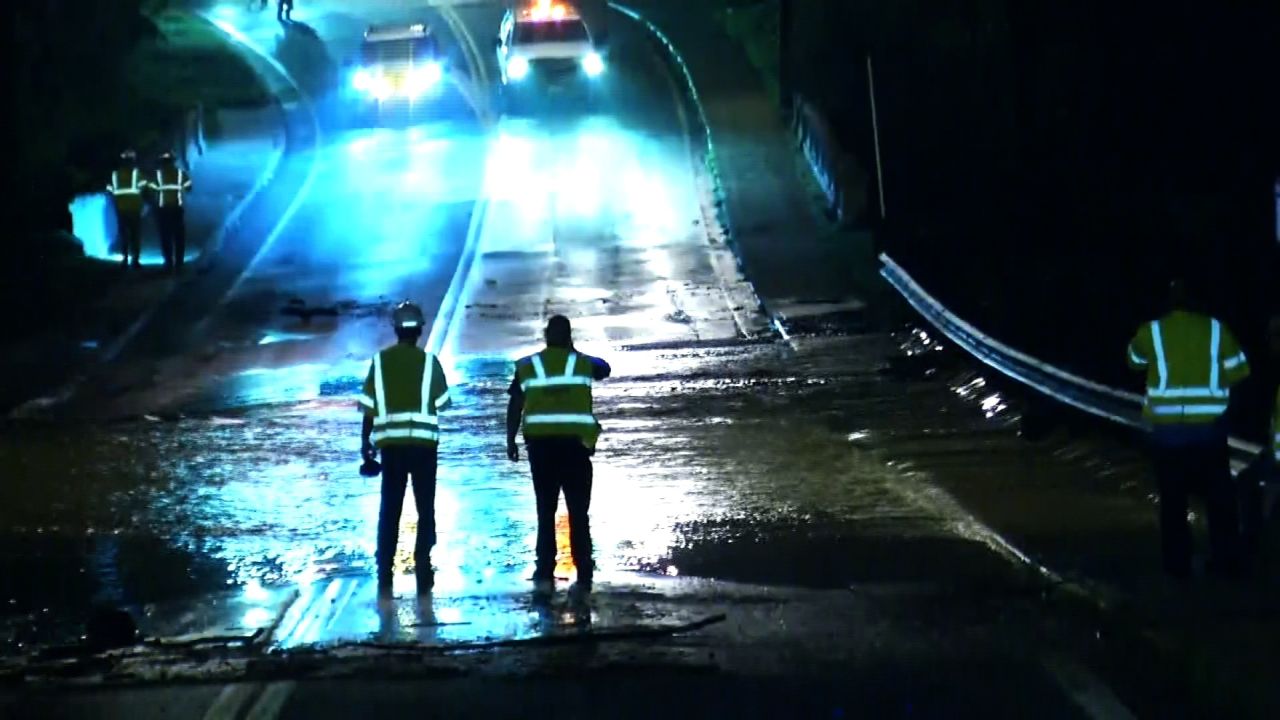 Emergency crews monitor water flow at the College Lake Dam near Lynchburg, Virginia after flash flooding in the area 
