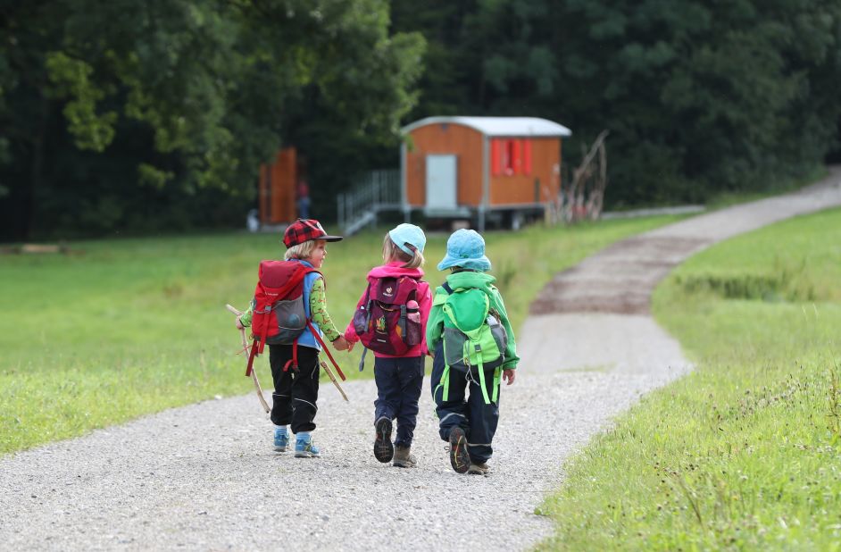 Children walk to forest kindergarten, which is held mostly outdoors, in Wessling, a municipality in Bavaria, Germany.