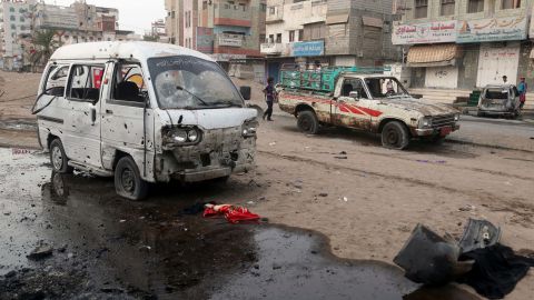 An airstrike leaves cars damaged Thursday at the entrance of Al-Thawra Hospital in Hodeidah, Yemen.