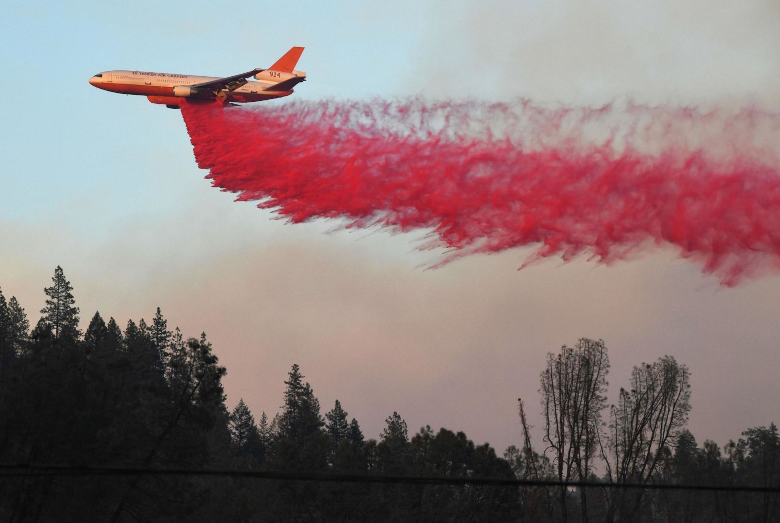 An air tanker drops fire retardant near Redding on August 2.