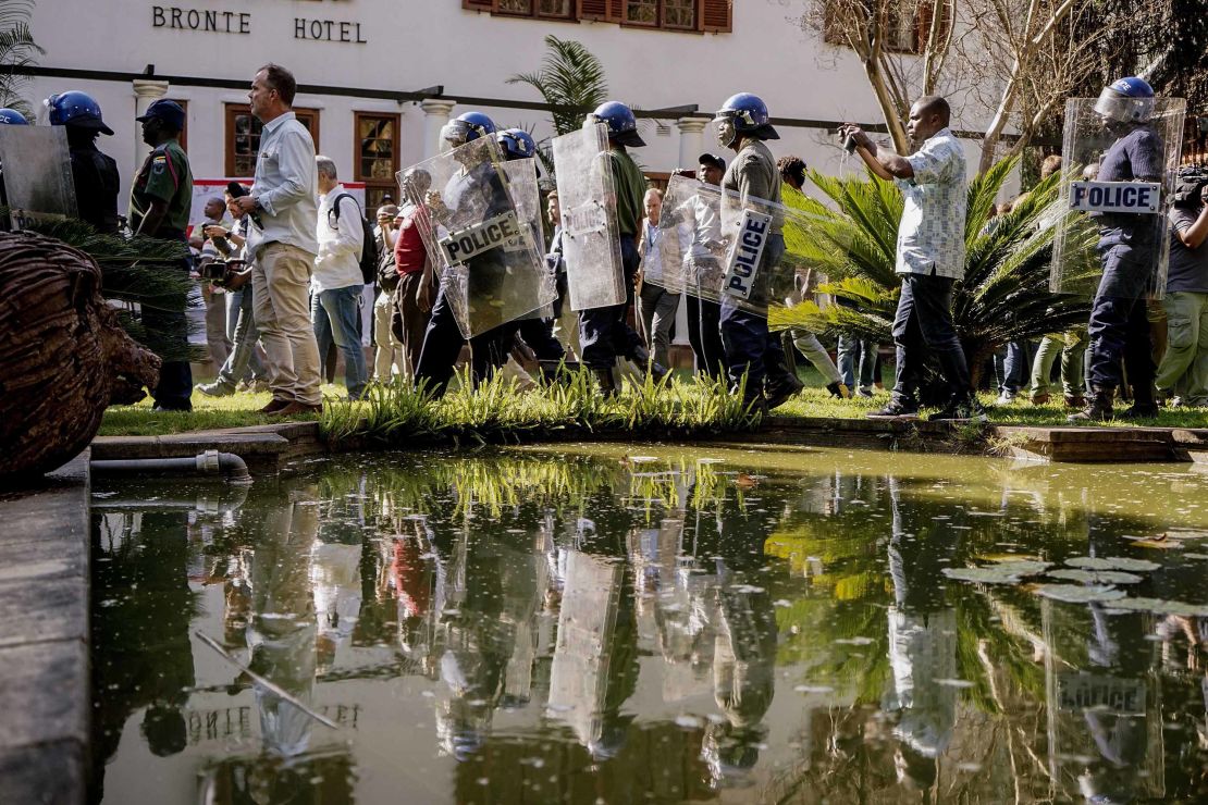 Zimbabwe anti-riot police personnel deploy Friday at the Bronte Hotel in Harare.