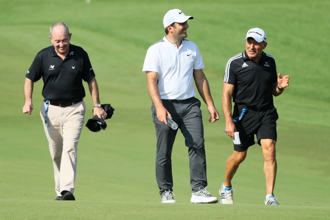 Italian golfer Francesco Molinari (center) with swing coach Denis Pugh (left) and performance coach Dave Alred (right).