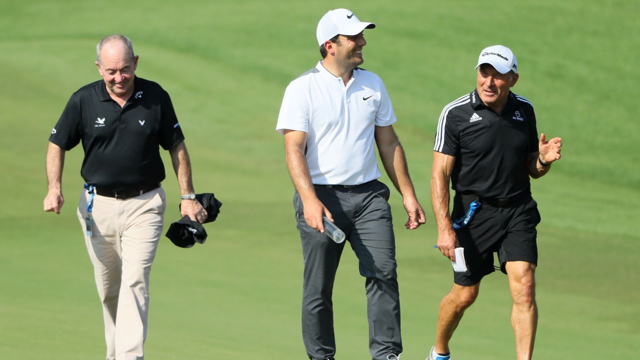 Italian golfer Francesco Molinari (center) with swing coach Denis Pugh (left) and performance coach Dave Alred (right).