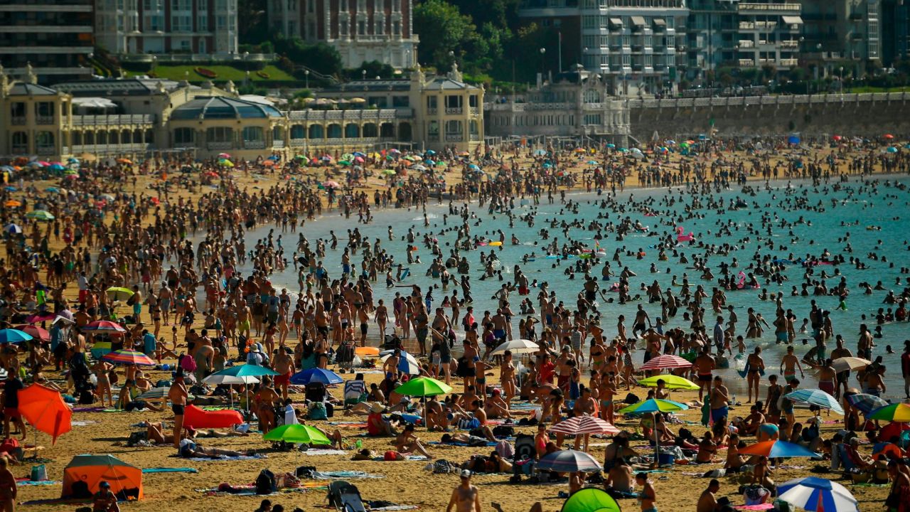People crowd La Concha beach Friday in the Basque city of San Sebastian in northern Spain.
