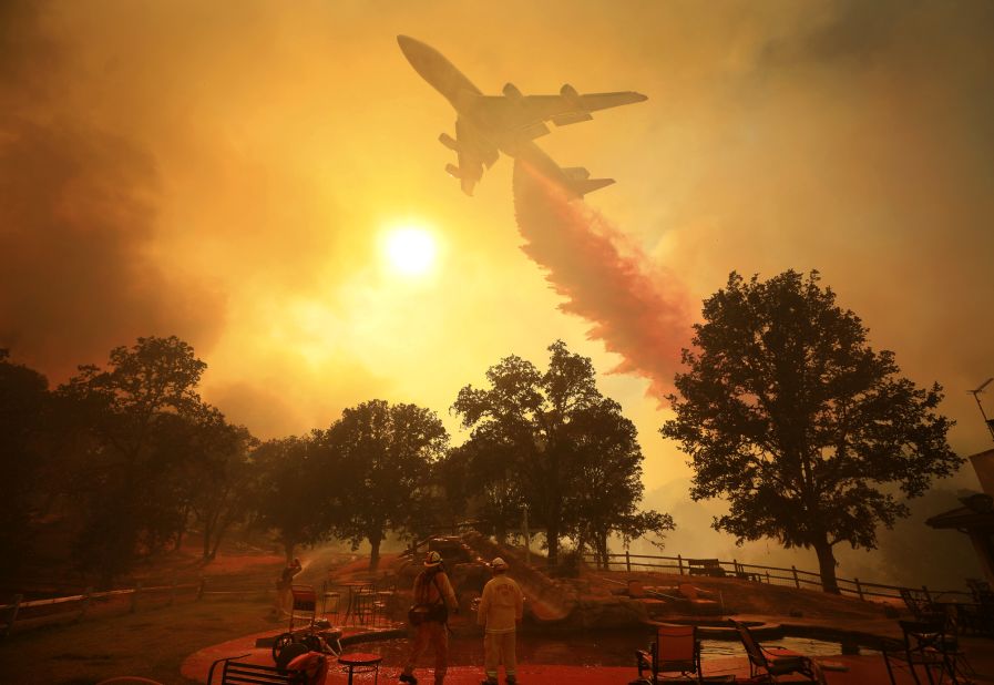 An airplane drops fire retardant in Lakeport on Thursday, August 2.