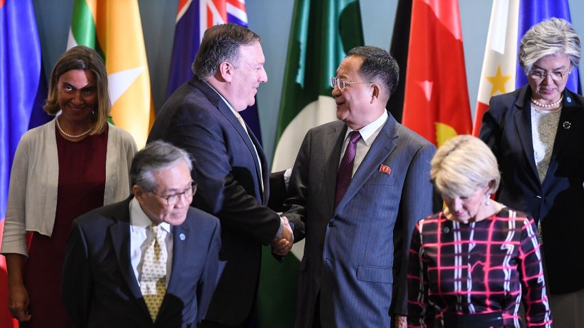 US Secretary of State Mike Pompeo (3rd L) shakes hands with North Korea's Foreign Minister Ri Yong Ho (3rd R) as they arrive for a group photo at the ASEAN Regional Forum Retreat during the 51st Association of Southeast Asian Nations (ASEAN) Ministerial Meeting (AMM) in Singapore on August 4, 2018. - Leaders, ministers and representatives are meeting in the city-state from August 1 to 4 for the ASEAN Ministerial Meeting (AMM). (Photo by Mohd RASFAN / AFP)        (Photo credit should read MOHD RASFAN/AFP/Getty Images)