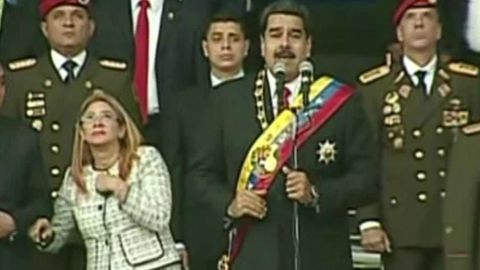 Maduro and his wife, Celia Flores, look up during the speech.