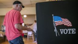 A voter arrives at a booth to fill out ballot at a polling location during the primary election in Lebanon Church, Virginia, U.S., on Tuesday, June 12, 2018. In the Shenandoah Valley's 6th Congressional district, four Democrats are running in the primary for the open seat being vacated by retiring Republican Bob Goodlatte. Photographer: Andrew Harrer/Bloomberg via Getty Images