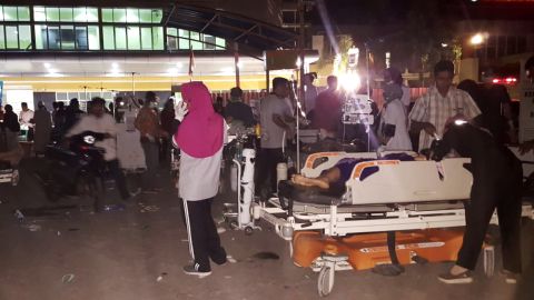 Medical staff treat patients outside a hospital on Lombok Island after an earthquake rocked Indonesia on Sunday.