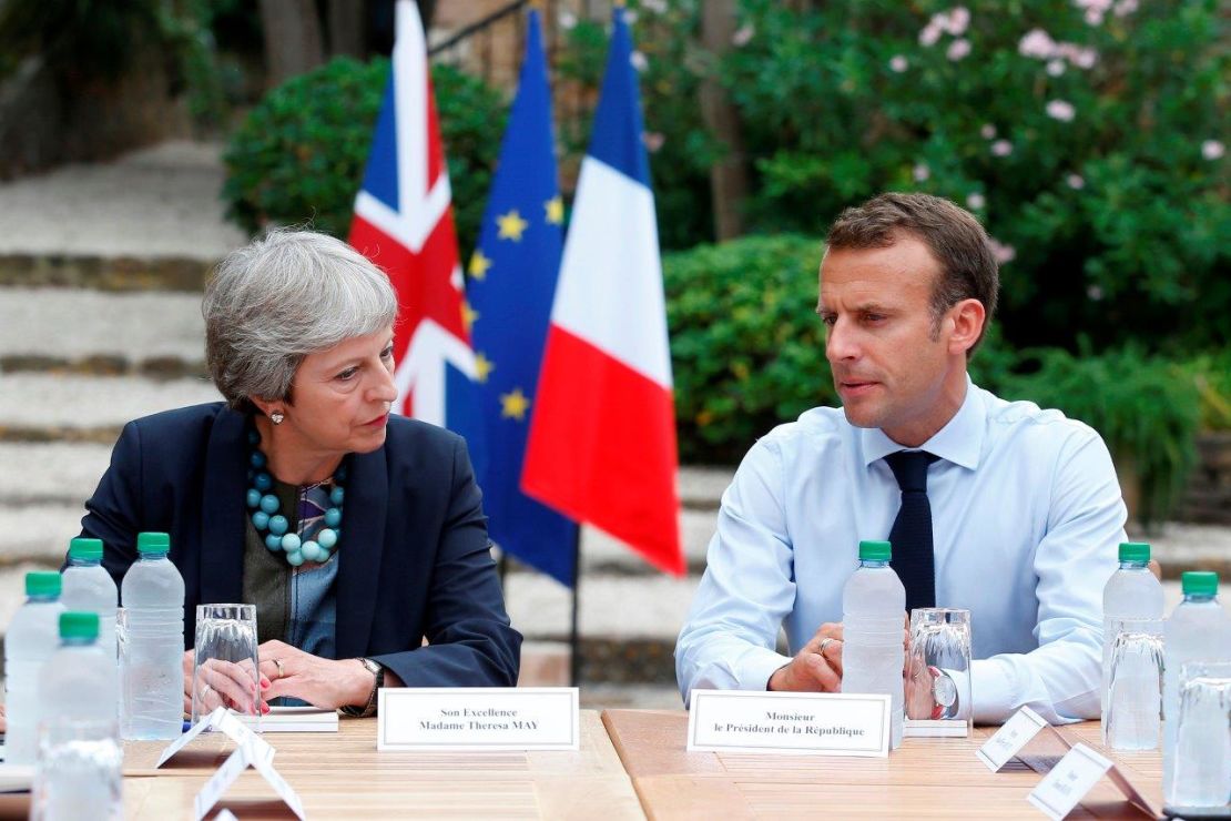 British Prime Minister Theresa May and French President Emmanuel Macron speak in southern France on Friday. 
