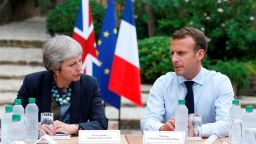 French President Emmanuel Macron (R) speaks with British Prime Minister Theresa May (L) during a meeting at Fort de Bregancon in Bormes-les-Mimosas, southern France on August 3, 2018. - May has cut short her holiday for the meeting at the French presidential summer retreat. (Photo by Sebastien NOGIER / POOL / AFP) (Photo credit should read SEBASTIEN NOGIER/AFP/Getty Images)
