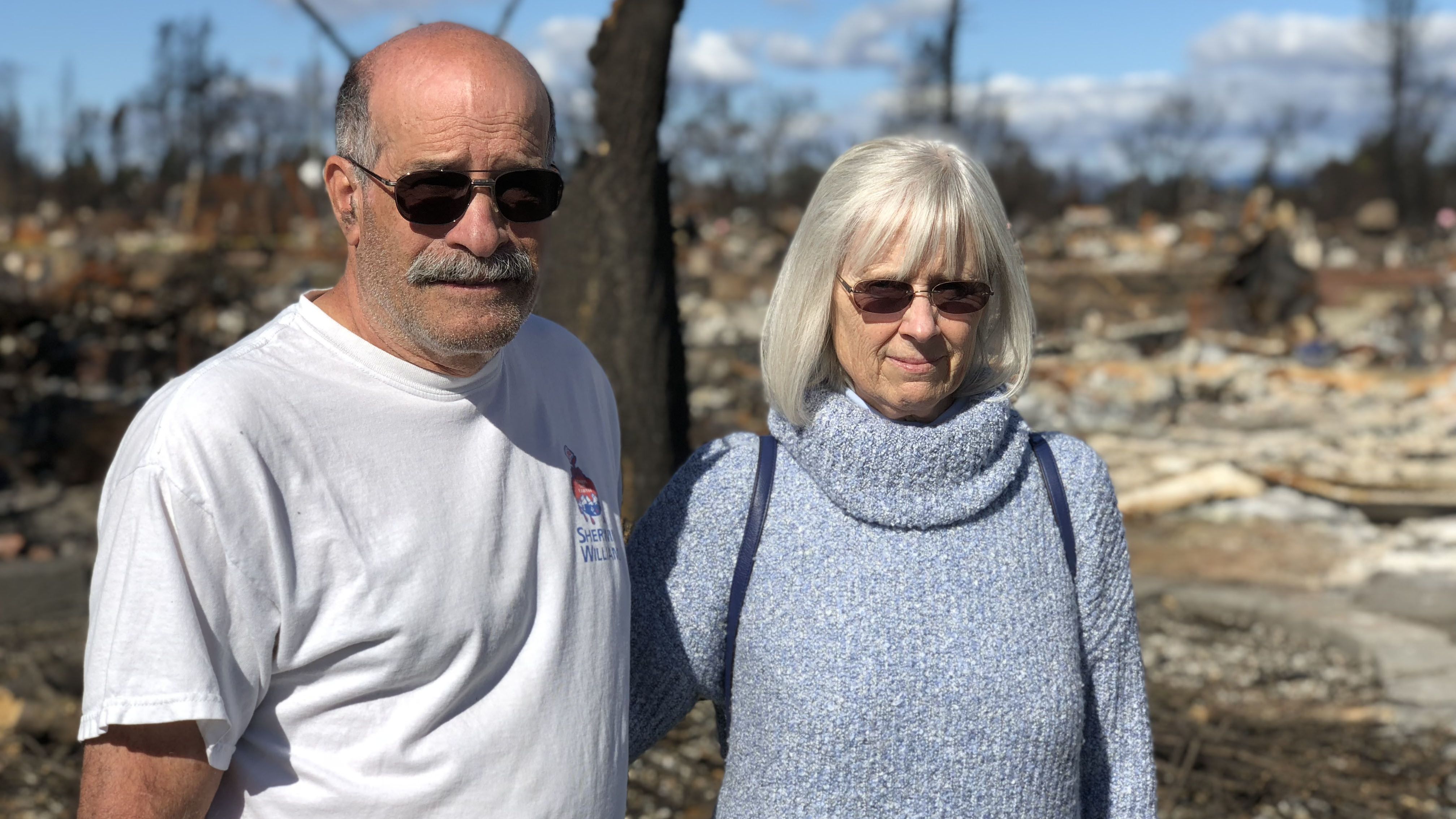 John Wimmer and his wife, Jody, visit their neighborhood following the 2017 wildfire.