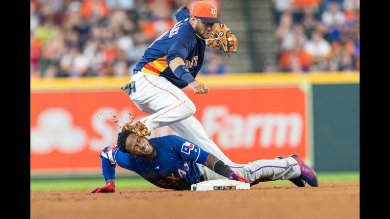 Texas Rangers shortstop Jurickson Profar is accidentally spiked in the face by Houston Astros second baseman Yuli Gurriel in the top of the sixth inning during a game between the Texas Rangers and the Houston Astros in Houston, Texas on Sunday, July 29.