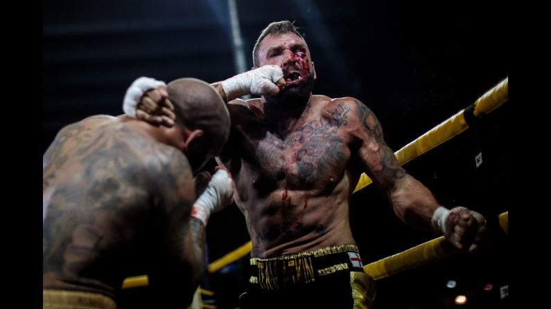 Two-time World Bare-Knuckle Boxing Champion Luke Atkin is hit by Dom Clark during the Rogue Elite world title main event at an Ultimate Bare Knuckle Boxing fight, at Bowlers Exhibition Centre on Saturday, August 4, in Manchester, England. 