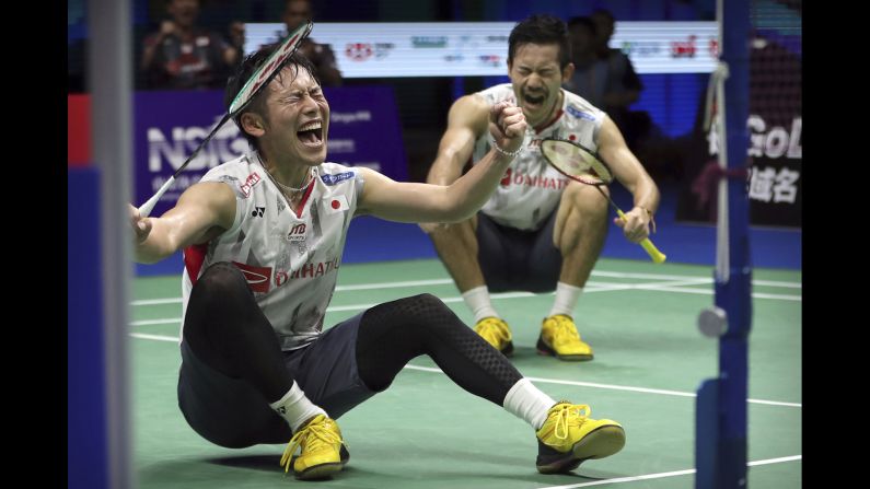 Takeshi Kamura, left, and Keigo Sonoda celebrate after beating Marcus Fernaldi Gideon and Kevin Sanjaya Sukamuljo on their men's badminton doubles quarterfinal match at the BWF World Championships in Nanjing, China, on Friday, August 3. 