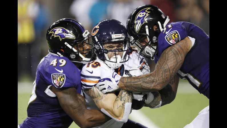 Kamalei Correa and Chris Board of the Baltimore Ravens are called for an illegal hit while tackling Tanner Gentry of the Chicago Bears in the third quarter of the Hall of Fame Game at Tom Benson Hall of Fame Stadium on Thursday, August 2, in Canton, Ohio. 