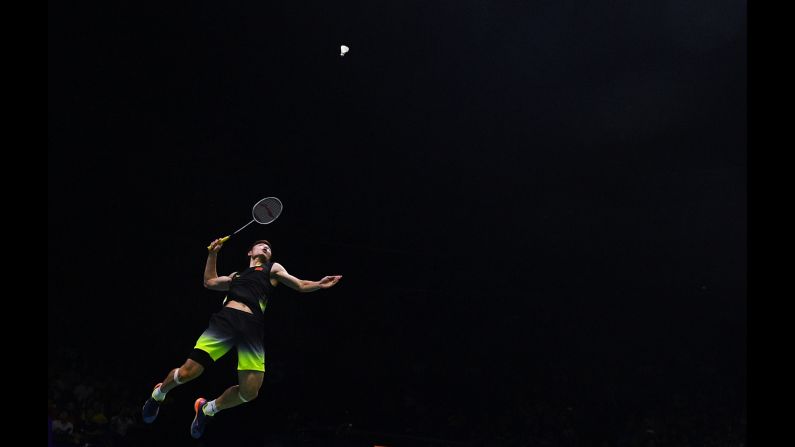 Shi Yuqi hits a shot against Chen Long in their men's singles semi-final match during the badminton World Championships in Nanjing, China on Saturday, August 4. 