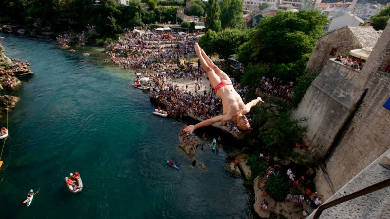 A diver jumps from the Old Mostar Bridge during the 452nd traditional annual high diving competition, in Mostar, Bosnia, on Sunday, July 29. A total of 40 divers from Bosnia and neighboring countries leapt from the 82-foot high bridge into the Neretva River. 