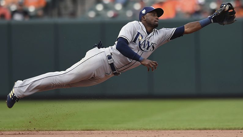 Tampa Bay Rays shortstop Adeiny Hechavarría stops a ground ball hit by Mark Trumbo in the eighth inning on Sunday, July 29, in Baltimore. 