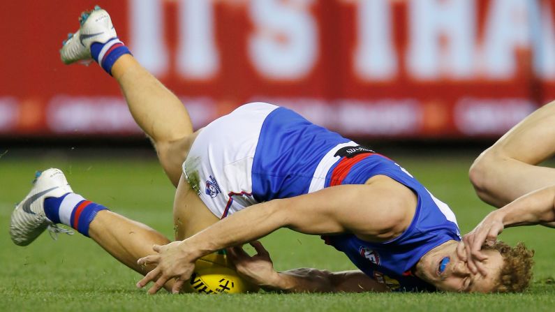 Jimmy Webster of the Saints tackles Mitch Wallis of the Bulldogs high during the round 20 AFL match between the St. Kilda Saints and the Western Bulldogs on Saturday, August 4, in Melbourne, Australia.  