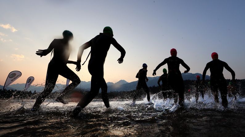 Athletes compete in the swim portion of the IRONMAN Canada event on Sunday, July 29, in Whistler, Canada.  