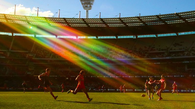 A general view of play as the sun shines and Lachie Weller of the Suns and Bayley Fritsch of the Demons compete for the ball during the round 20 AFL match between the Melbourne Demons and the Gold Coast Suns at Melbourne Cricket Ground on Sunday, August 5, in Melbourne, Australia. 