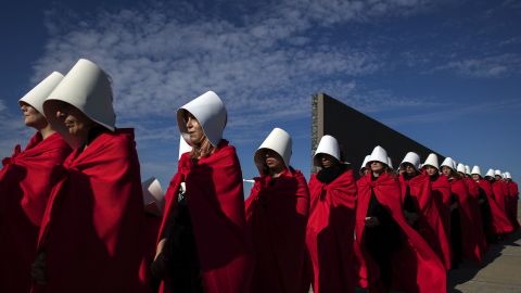 Activists in favor of legalizing abortion march in Buenos Aires dressed as women from Margaret Atwood's "The Handmaid's Tale."