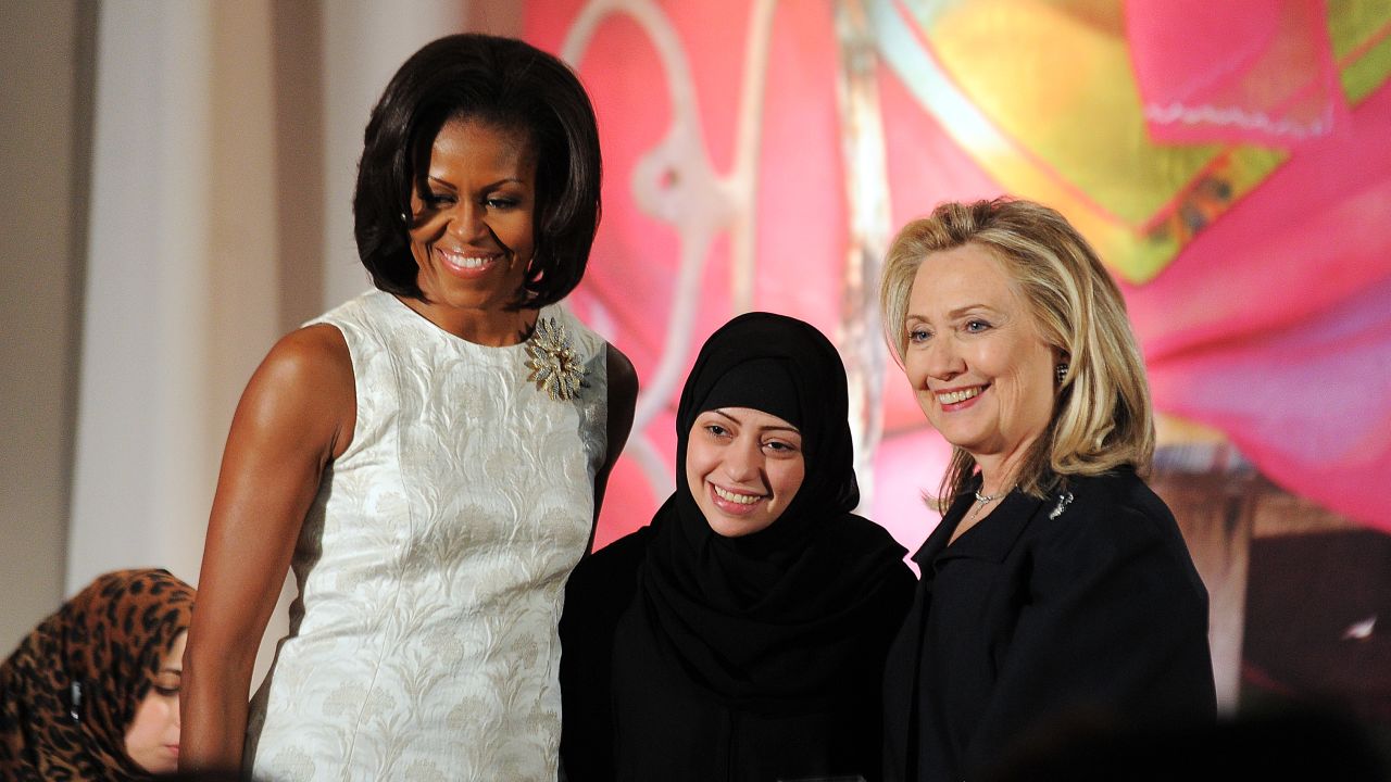 Samar Badawi, center, receiving the 2012 International Women of Courage Award during a ceremony with then-US First Lady Michelle Obama, left, and then-US Secretary of State Hillary Cllinton.