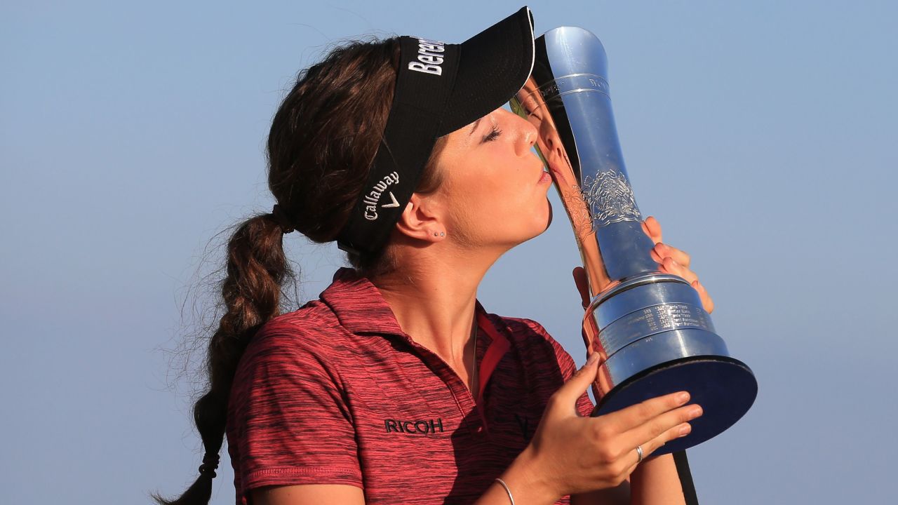 Georgia Hall of Great Britain poses with her trophy after winning the 2018 Women's British Open Golf Championships at Royal Lytham & St. Annes Golf Club, north west England, on August 5, 2018. (Photo by Lindsey PARNABY / AFP) / The erroneous mention appearing in the metadata of this photo has been modified in AFP systems in the following manner: Byline reads [Lindsey PARNABY] instead of [Fred TANNEAU]. Please immediately remove the erroneous mention[s] from all your online services and delete it (them) from your servers. If you have been authorized by AFP to distribute it (them) to third parties, please ensure that the same actions are carried out by them. Failure to promptly comply with these instructions will entail liability on your part for any continued or post notification usage. Therefore we thank you very much for all your attention and prompt action. We are sorry for the inconvenience this notification may cause and remain at your disposal for any further information you may require.        (Photo credit should read LINDSEY PARNABY/AFP/Getty Images)