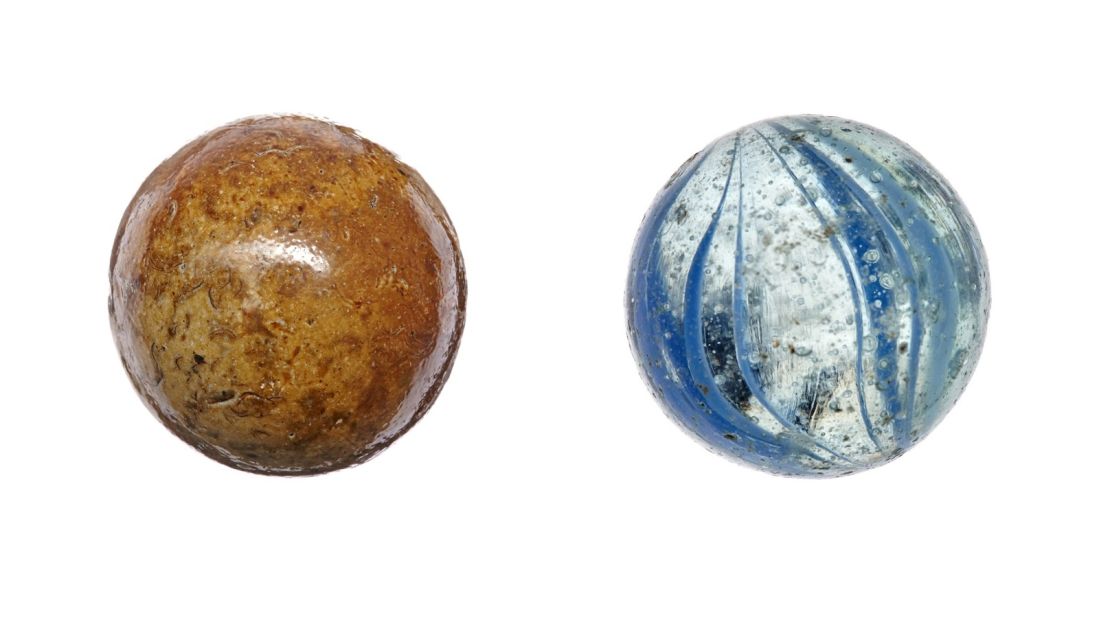 The Damrak site yielded weapons that affirmed its military history. But toys also indicated it was a public space where kids played. The marble on the left was found in Damrak and dates back some 500 years ago.