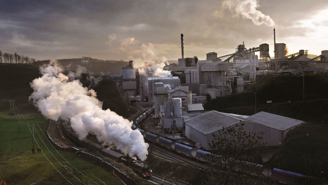 Pictured here: LMS Black 5 No. 45407 passes Tunstead Works (limestone), Great Rocks Dale