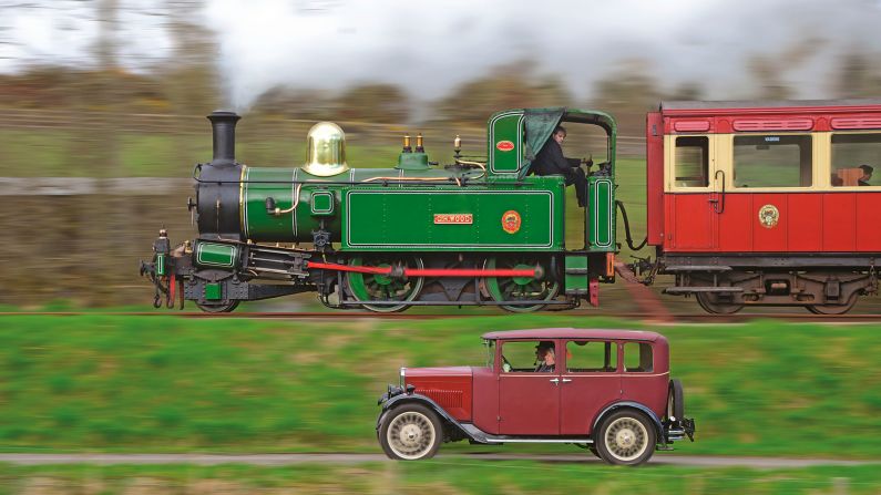 <strong>Racing the train</strong>: "The train racing the car was taken on a photo charter on the Isle of Man" says Robin. "The lesson of this is always be really for an opportunity that presents itself and the shot may not be the one originally intended." <em>Pictured here: Racing the train. Beyer, Peacock & Co. Isle of Man No. 10 G. H. Wood races a 1931 Swift Crusader at Scanton, Isle of Man.</em>