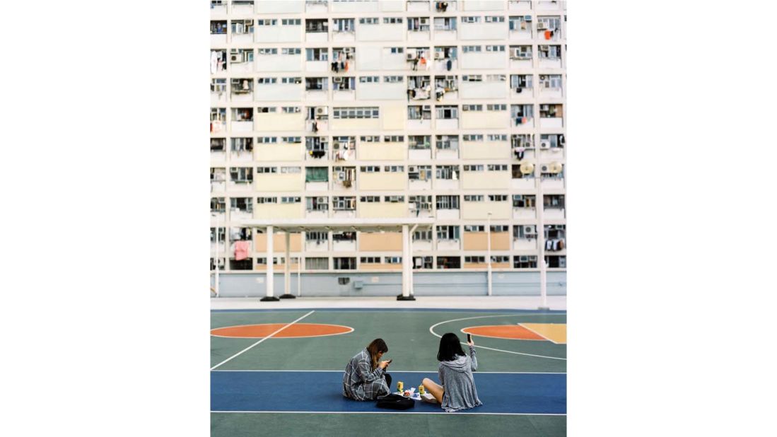 <strong>Court order:</strong> "To capture this quiet moment, I made my way to the colorful Choi Hung Estate -- the oldest public housing estate," says Hab. "The scene really shows what youth is today ... homework, cell phones, friends. It shows how the next generation changes so quickly. As for the composition, I used a used new Kodak Portra film for my Pentax and waited a long time, because I really wanted to have the full scene totally empty."<br />
