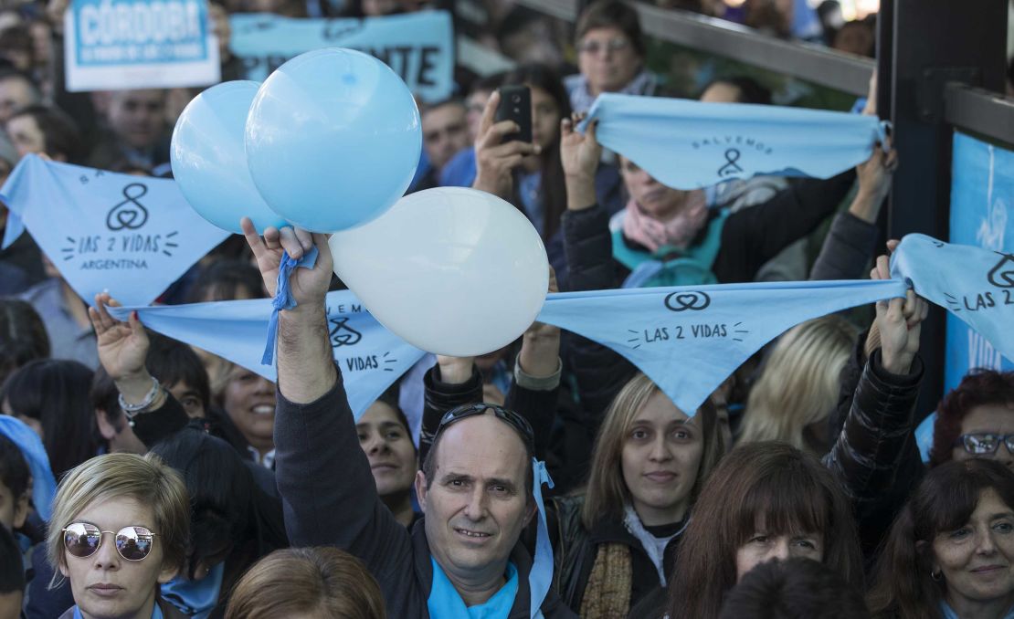 People demonstrate against the bill under the slogan "Let's Save Both Lives" in Buenos Aires.