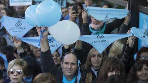 People demonstrate against the bill under the slogan "Let's Save Both Lives" in Buenos Aires.
