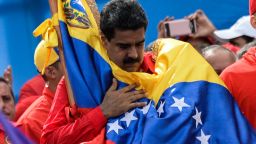 TOPSHOT - Venezuelan President Nicolas Maduro holds a national flag during the closing of the campaign to elect a Constituent Assembly that would rewrite the constitution, in Caracas on July 27, 2017 on the second day of a 48-hour general strike called by the opposition.
Venezuela's opposition called for a nationwide protest on Friday in outright defiance of a new government ban on demonstrations ahead of a controversial weekend election. "The regime declared we can't demonstrate... We will respond with the TAKING OF VENEZUELA tomorrow," the opposition coalition, the Democratic Unity Roundtable, said Thursday on its Twitter account.
 / AFP PHOTO / Federico PARRA        (Photo credit should read FEDERICO PARRA/AFP/Getty Images)