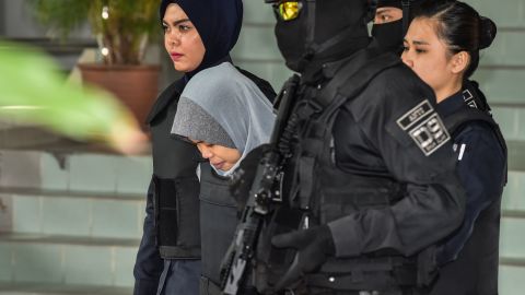 Siti Aisyah (center) is escorted by Malaysian police after a court session for her trial at the Shah Alam High Court in Shah Alam, outside Kuala Lumpur on June 27.