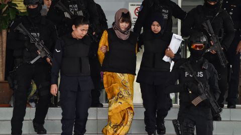 Doan Thi Huong (center) is escorted by Malaysian police at the Shah Alam High Court in Shah Alam, outside Kuala Lumpur on June 27.
