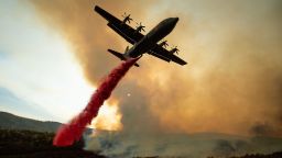 TOPSHOT - An air tanker drops retardant on the Ranch Fire, part of the Mendocino Complex Fire, burning along High Valley Rd near Clearlake Oaks, California, on August 5, 2018. - Several thousand people have been evacuated as various fires swept across the state, although some have been given permission in recent days to return to their homes. (Photo by NOAH BERGER / AFP)        (Photo credit should read NOAH BERGER/AFP/Getty Images)
