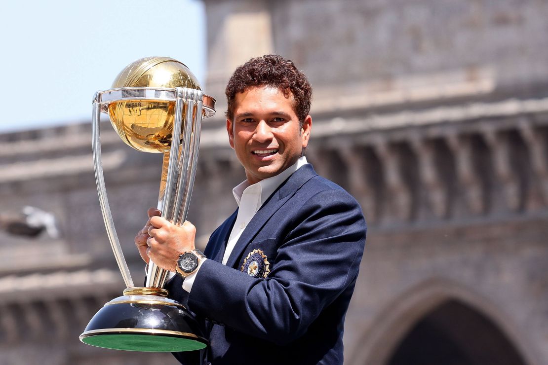 Sachin Tendulkar poses with the  ICC Cricket World Cup Trophy in 2011.