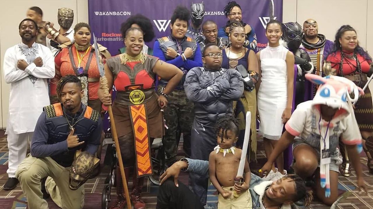 Cosplayers dressed in their Wakandan finest pose for a group photo at the first-ever WakandaCon in Chicago, Illinois.