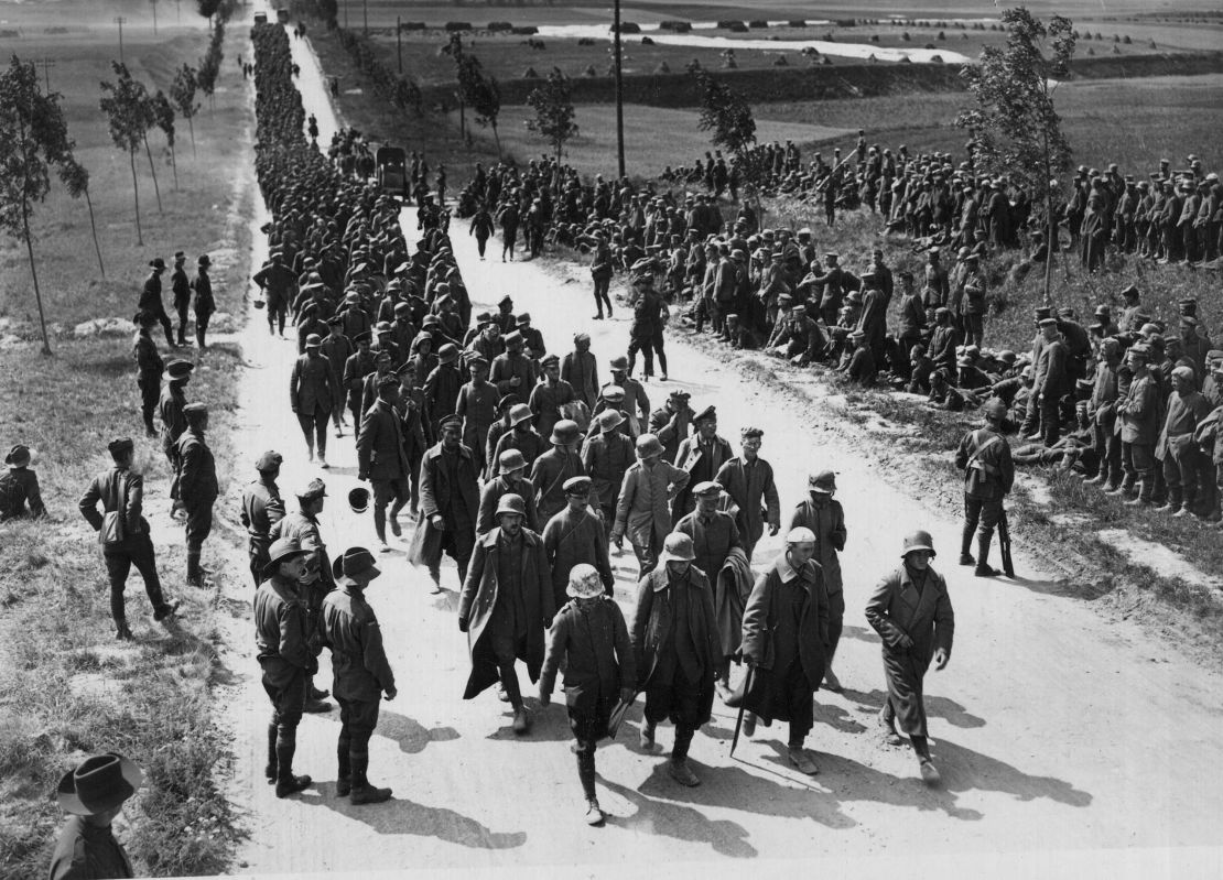 Prisoners arriving at a "cage" near Amiens, following fighting for the town in August 1918. 