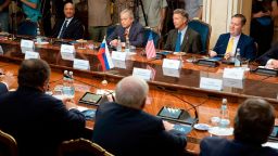 Top from left: a member of the Senate of the legislative Assembly of the state of Texas Peter Hettler, Texas Sen. Don Huffines, Sen. Rand Paul and his communications director Sergio Gor attend a meeting with Russian lawmakers in Moscow, Russia, Monday, Aug. 6, 2018. Paul said he has invited Russian lawmakers to visit the United States to help foster inter-parliamentary contacts. (AP Photo/Pavel Golovkin)