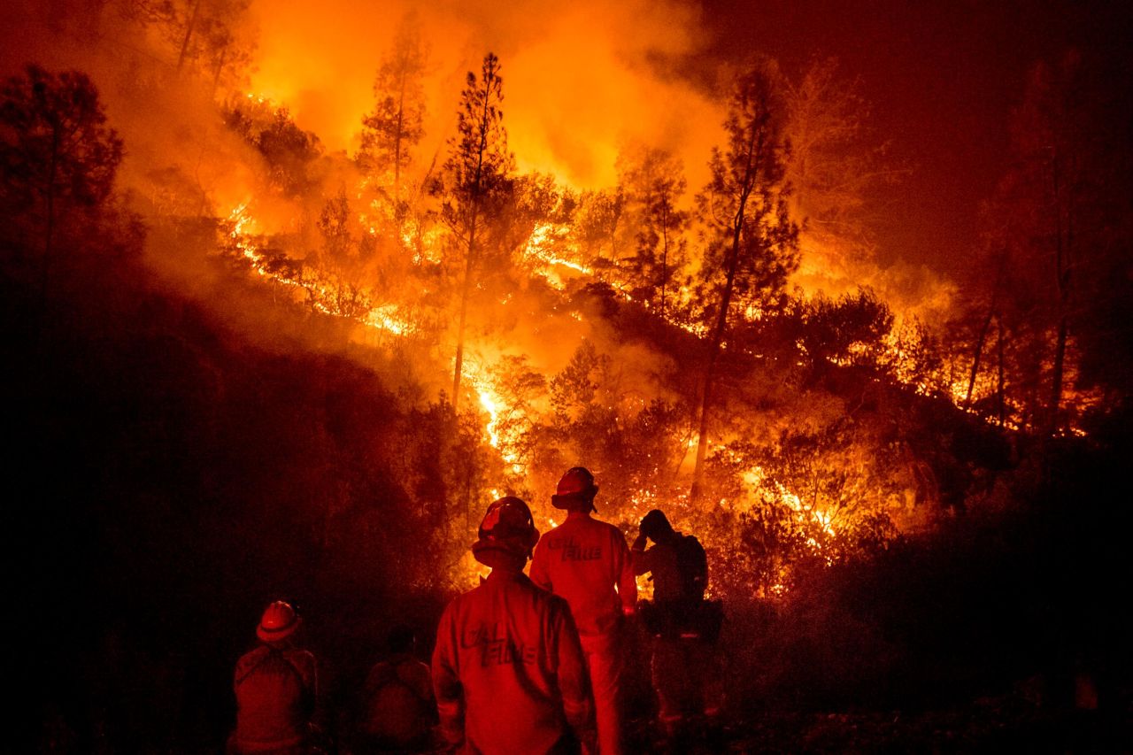Firefighters monitor a backfire while battling part of the Mendocino Complex Fire near Ladoga on Tuesday, August 7.