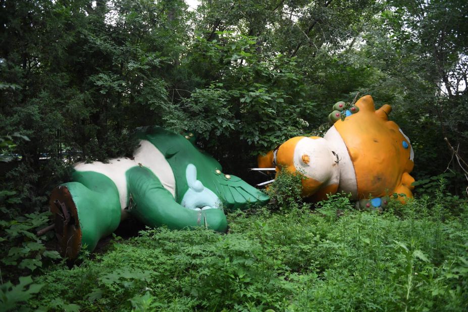 <strong>Forgotten moments:</strong> It's been 10 years since Beijing hosted the 2008 Olympics. A decade later, many of the structures and venues lie abandoned. In some cases, they never came to fruition in the first place. Here, two of the Games' mascots, Nini and Yingying, lie in a wooded area behind a never-completed mall.