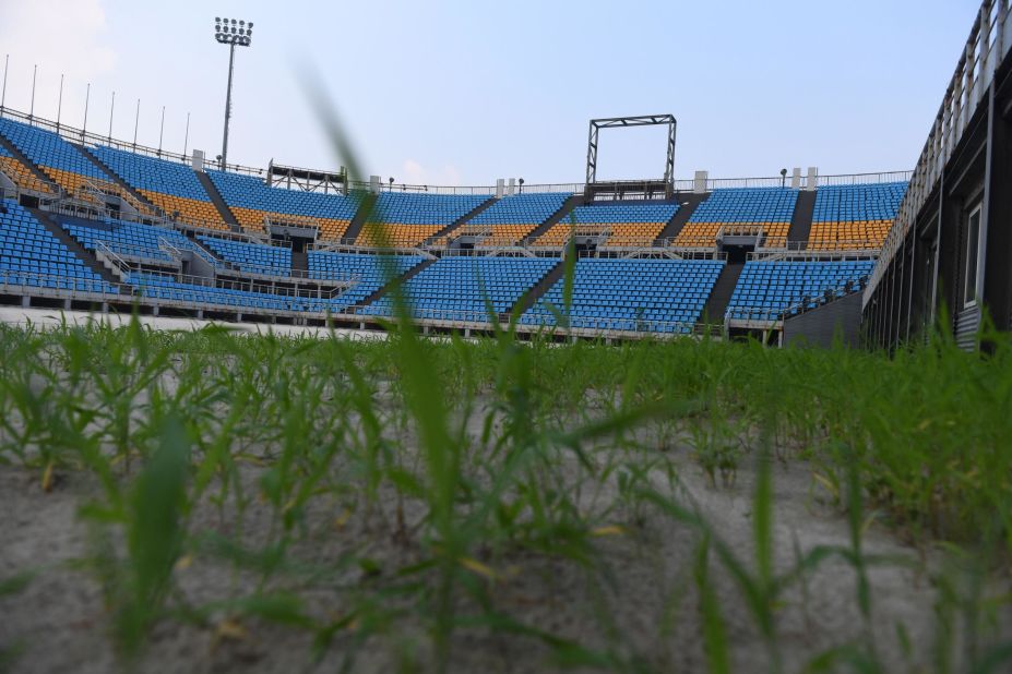 <strong>Gone wild:</strong> Inside the Beach Volleyball stadium, it's equally eerie and weeds are growing wild.