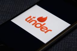 The "Tinder" app logo is seen on a mobile phone screen on November 24, 2016.