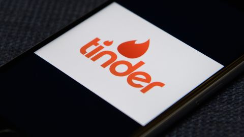 The "Tinder" app logo is seen on a mobile phone screen on November 24, 2016.