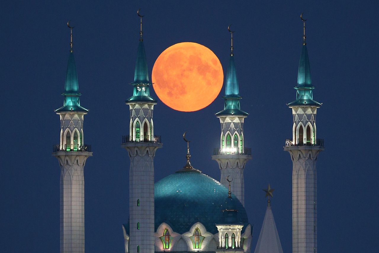The blood moon is seen over the Qolsarif Mosque in Kazan, Russia, on Friday, July 27.